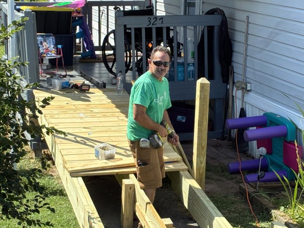 Richie Boden works on a wheelchair ramp as part of the Birdsboro Shares ministry. (Courtesy of Stuart Wells )