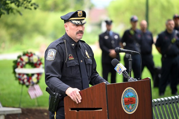Reading Police Assistant Chief Aaron Demko speaks during Reading's commemoration of the 25th Anniversary of Sept. 11, 2001, on Friday in City Park.   (BILL UHRICH/READING EAGLE)