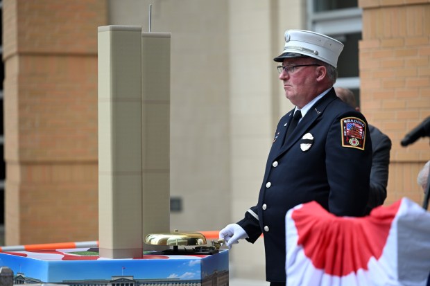 Reading Fire Department Lt. John Naylor rings the bell honoring those who lost their lives in the attacks and who later died from disease from working at Ground Zero during the Berks Remembers 25th Anniversary of Sept. 11, 2001, on Friday at the Berks County Services Center. (BILL UHRICH/READING EAGLE)