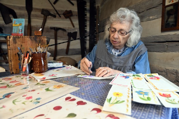 Pat Oxenford of Douglassville creates decoratively painted book marks during the Heemet Fescht at the Pennsylvania German Cultural Heritage Center at Kutztown University on Saturday, Sept. 26, 2026. (BILL UHRICH/READING EAGLE)
