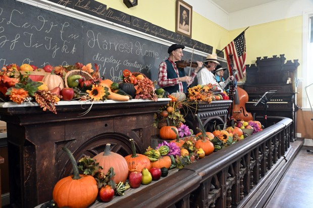 The Mike Hertzog Trio performs a Pennsylvania German version of Johnny Cash's "Folsom Prison Blues" in the Freyberger one-room schoolhouse during the Heemet Fescht at the Pennsylvania German Cultural Heritage Center at Kutztown University on Saturday, Sept. 26, 2026. (BILL UHRICH/READING EAGLE)