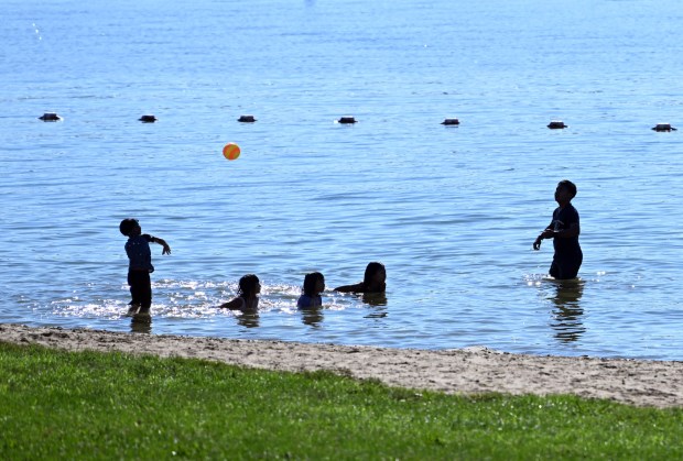 Youngsters play with a ball on the beach at Blue Marsh Lake on Labor Day Monday, Sept. 7, 2026. (BILL UHRICH/READING EAGLE)