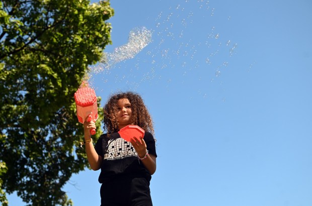 Elena Gonzalez, 7, daughter of Chris and Kayla Gonzalez of Oley Township creates a bubble storm in City Park on Labor Day Monday, Sept. 7, 2026. (BILL UHRICH/READING EAGLE)