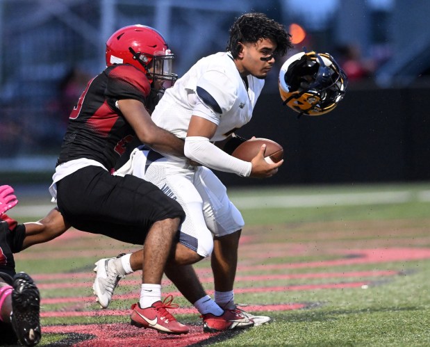 Muhlenberg quarterback Adriel Baez loses his helmet as he is sacked for a safety against Reading High at Shirk Stadium on Thursday, Sept. 3, 2026. (BILL UHRICH/READING EAGLE)