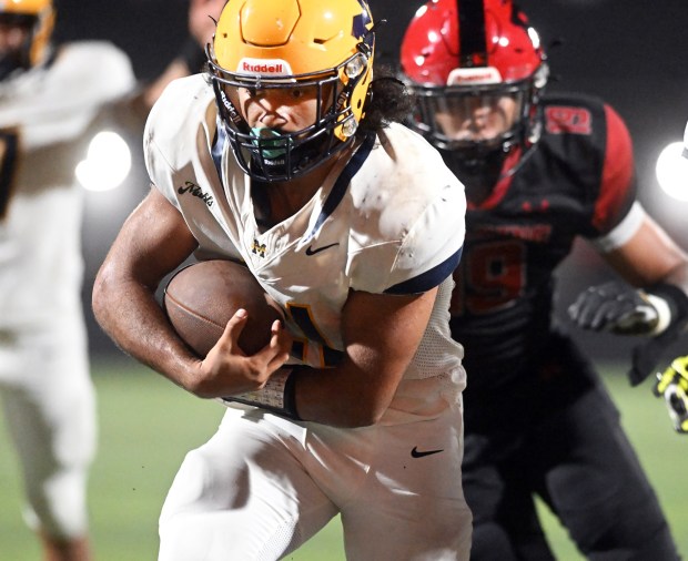 Muhlenberg's Ian Rodriguez scores the Muhls' third touchdown against Reading High at Shirk Stadium on Thursday, Sept. 3, 2026. (BILL UHRICH/READING EAGLE)