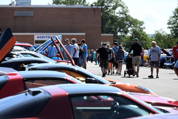 Fairgoers look over classic vehicles during the Oley Valley Community Fair on Saturday, Sept. 19, 2026, (BILL UHRICH/READING EAGLE)