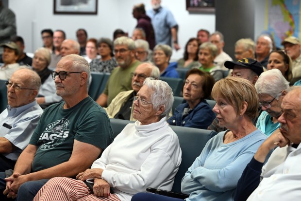 Residents hear a presentation on Route 183 projects in the planning and design stages during a forum at Reading Regional Airport. (BILL UHRICH/READING EAGLE)