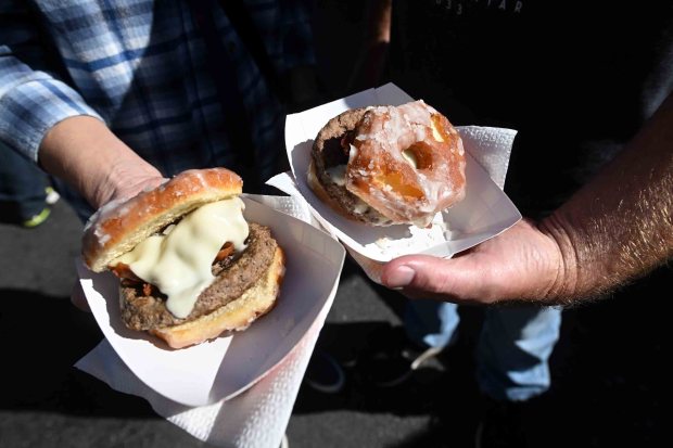 Luther Burgers, hamburgers on a glazed donut bun, during the Taste of Hamburg Festival on Aug. 30, 2025. (BILL UHRICH/READING EAGLE)