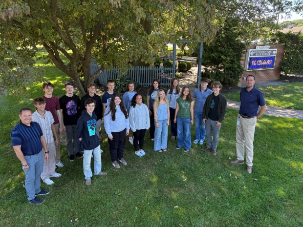 Kutztown High School Principal Dr. Matthew Campbell, right, and Advanced Placement government teacher Chris Schumacher with AP students. The school achieved a high ranking in the U.S. News World Report survey of American high schools. (Bill Uhrich - Reading Eagle)