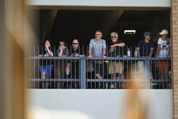 Railfans look out from the The Marketplace at Steamtown parking garage to watch the Union Pacific Big Boy 4014 steam locomotive depart the Steamtown National Historic Site in Scranton Wednesday, July 1, 2026. (SEAN MCKEAG / STAFF PHOTOGRAPHER)
