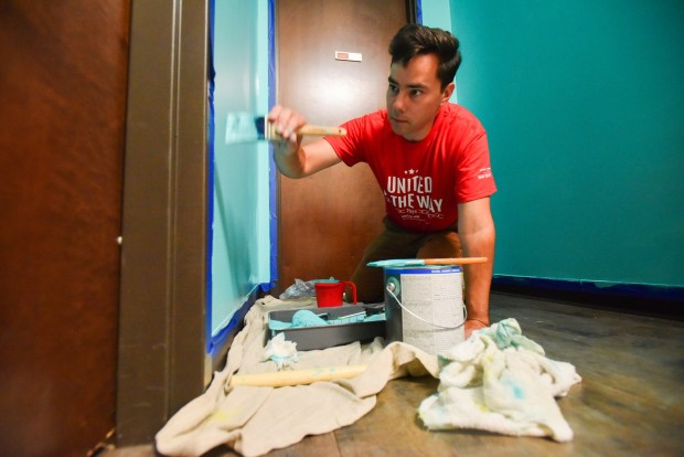 Posture Interactive Business Coordinator Johnathon Burns paints the walls inside of Outreach Center for Community Resources in Scranton for the United Way Day of Caring in Scranton Thursday, September 3, 2026. (SEAN MCKEAG / STAFF PHOTOGRAPHER)