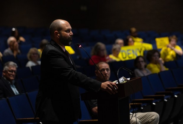 Attorney Justin Richards, who represents Archbald residents opposing data centers, questions a data center representative during a conditional use hearing at the Valley View High School auditorium in Archbald on Thursday, June 18, 2026. (FRANK WILKES LESNEFSKY / STAFF PHOTO)