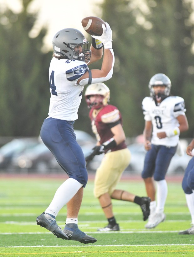 Pocono Mountain West's Christian Stiehler makes a catch during the game against Scranton at Veterans Memorial Stadium in Scranton Friday, Aug. 22, 2025. (SEAN MCKEAG / STAFF PHOTOGRAPHER)
