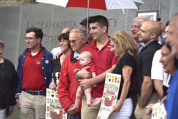 Board members, committee volunteers and civic officials associated with La Festa Italiana, celebrating the 50th anniversary of its founding, raised the Italian flag on Courthouse Square in downtown Scranton on Monday, Aug. 31, 2026. (CHAD SEBRING/STAFF PHOTO)