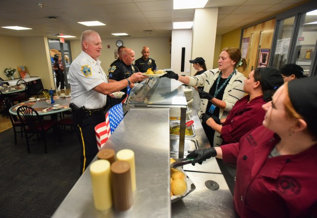 Culinary Lab Assistant Caitlynn Ondrako serves food to Scranton Police Department Deputy Chief Joseph Lafferty during the annual First Responder Luncheon at the school in Scranton Thursday, September 10, 2026. (SEAN MCKEAG / STAFF PHOTOGRAPHER)