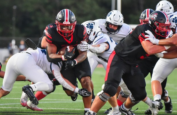 North Pocono's Jayden Taylor runs through the Berwick line for a touchdown at North Pocono Trojan Stadium in Moscow Friday, August 28, 2026. (SEAN MCKEAG / STAFF PHOTOGRAPHER)