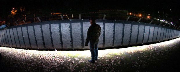 Vietnam era veteran Donny Knight, 64, of North Scranton, who served in the Army from 1966 to 1968 in Okinawa, Japan, observes the Wall That Heals at Nay Aug Park in Scranton in Oct. of 2011. Knight also is a member of the Friends of the Forgotten. (TIMES-TRIBUNE / FILE PHOTO)