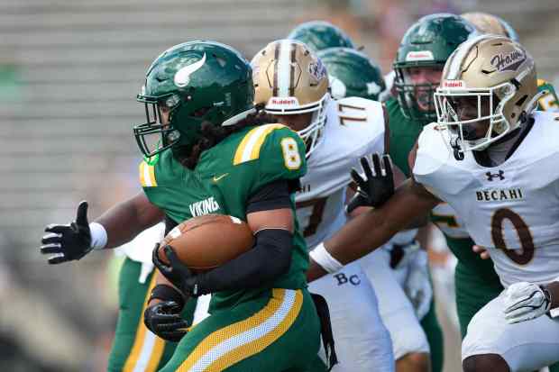 Allentown Central Catholic's Trey Torres-Johnson is tackled Bethlehem Catholic's Great Chifirst on Saturday, Sept. 5, 2026, at J. Birney Crum Stadium in Allentown.. (David Garrett/Special to The Morning Call)