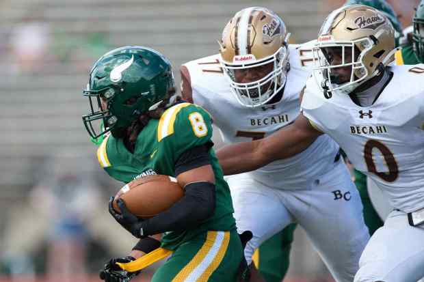 Allentown Central Catholic's Trey Torres-Johnson is tackled Bethlehem Catholic's Great Chifirst on Saturday, Sept. 5, 2026, at J. Birney Crum Stadium in Allentown.. (David Garrett/Special to The Morning Call)