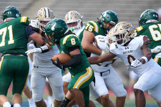 Allentown Central Catholic's Trey Torres-Johnson is tackled Bethlehem Catholic's Great Chifirst on Saturday, Sept. 5, 2026, at J. Birney Crum Stadium in Allentown.. (David Garrett/Special to The Morning Call)