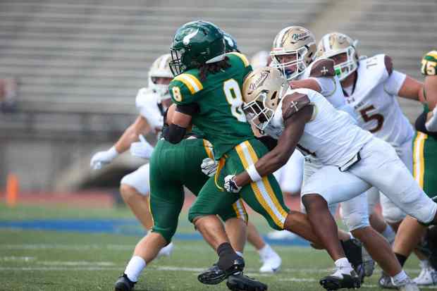 Allentown Central Catholic's Trey Torres-Johnson is tackled Bethlehem Catholic's Great Chifirst on Saturday, Sept. 5, 2026, at J. Birney Crum Stadium in Allentown.. (David Garrett/Special to The Morning Call)
