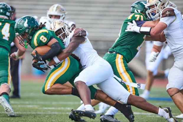 Allentown Central Catholic's Trey Torres-Johnson is tackled Bethlehem Catholic's Great Chifirst on Saturday, Sept. 5, 2026, at J. Birney Crum Stadium in Allentown.. (David Garrett/Special to The Morning Call)