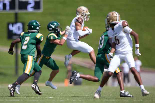 Bethlehem Catholic's Tyre Lewis  is tackled by Allentown Central Catholic's Grayson Schmell on Saturday, Sept. 5, 2026, at J. Birney Crum Stadium. (David Garrett/Special to The Morning Call)
