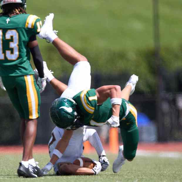 Bethlehem Catholic's Tyre Lewis  is tackled by Allentown Central Catholic's Grayson Schmell on Saturday, Sept. 5, 2026, at J. Birney Crum Stadium. (David Garrett/Special to The Morning Call)