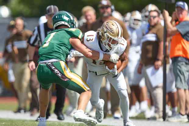 Bethlehem Catholic's Tyre Lewis  is tackled by Allentown Central Catholic's Grayson Schmell on Saturday, Sept. 5, 2026, at J. Birney Crum Stadium. (David Garrett/Special to The Morning Call)