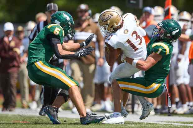 Bethlehem Catholic's Tyre Lewis  is tackled by Allentown Central Catholic's Grayson Schmell on Saturday, Sept. 5, 2026, at J. Birney Crum Stadium. (David Garrett/Special to The Morning Call)