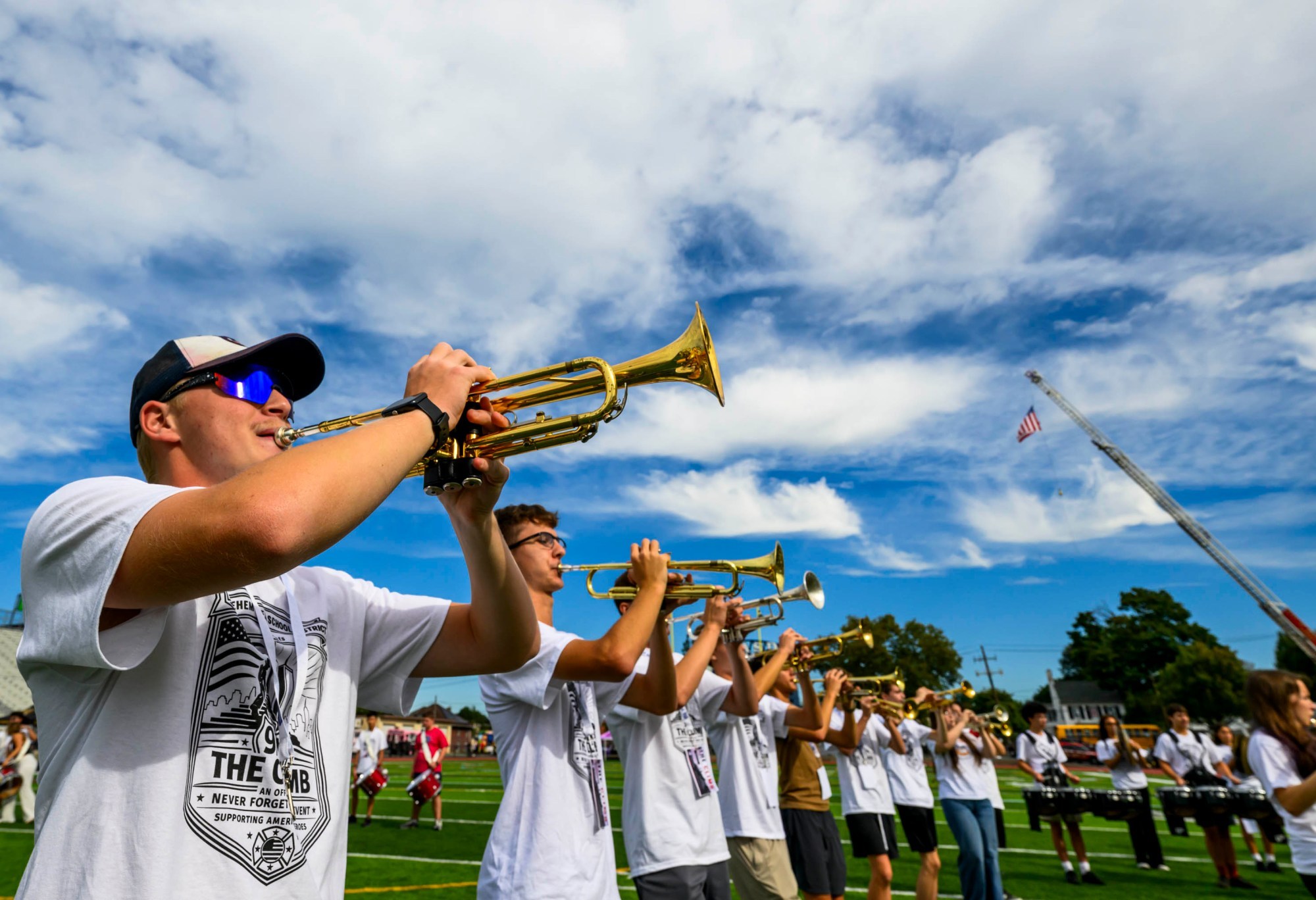 Freedom High School senior Parker Chepolis plays patriotic music on his trumpet with the rest of the Freedom Marching Band on Friday, Sept. 11, 2026, during "The Climb" event at BASD Stadium in Bethlehem. Bethlehem Area high school students, staff, first responders, military personnel and community partners came together for a student-centered 9/11 remembrance event in which students from Freedom and Liberty High Schools climbed the stadium steps, walked the track and engaged in other activities to remember the lives lost 25 years ago. The goal was to climb 2,200 stairs or walk three miles, symbolizing 110 flights of stairs in one of the World Trade Center towers.(April Gamiz/The Morning Call)