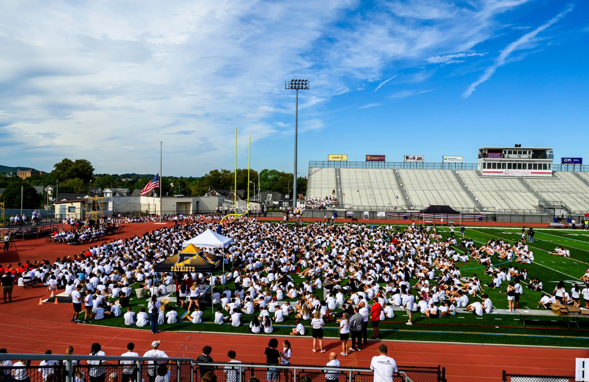Over 2,300 students and others gather Friday, Sept. 11, 2026, for "The Climb" event at BASD Stadium in Bethlehem. Bethlehem Area high school students, staff, first responders, military personnel and community partners came together for a student-centered 9/11 remembrance event in which students from Freedom and Liberty High Schools climbed the stadium steps, walked the track and engaged in other activities to remember the lives lost 25 years ago. The goal was to climb 2,200 stairs or walk three miles, symbolizing 110 flights of stairs in one of the World Trade Center towers. (April Gamiz/The Morning Call)