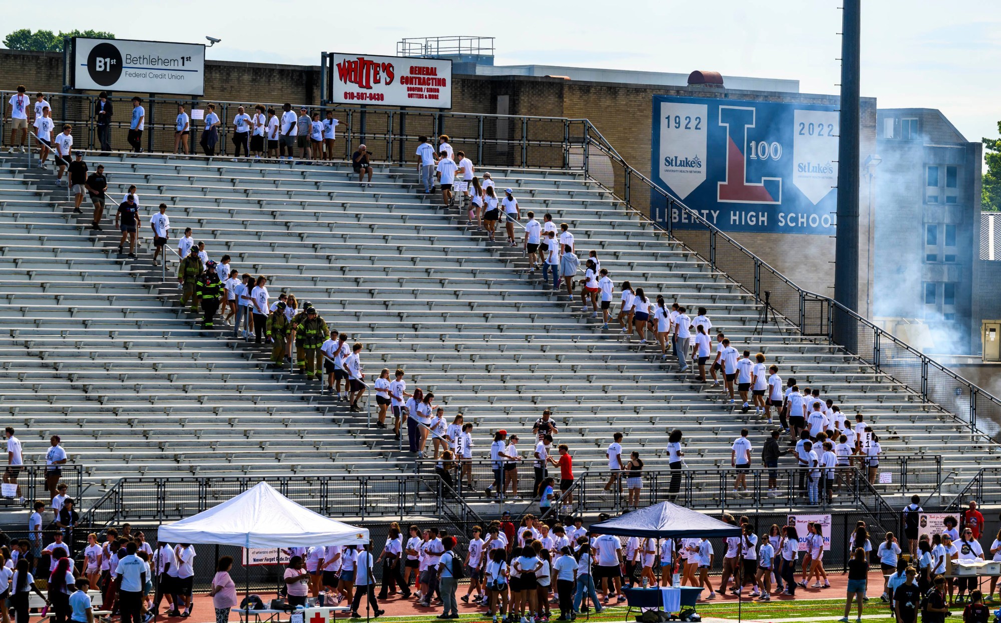 Students climb the stadium steps with local firefighters Friday, Sept. 11, 2026, at BASD Stadium in Bethlehem. Bethlehem Area high school students, staff, first responders, military personnel and community partners came together for a student-centered 9/11 remembrance event in which students from Freedom and Liberty High Schools climbed the stadium steps, walked the track and engaged in other activities to remember the lives lost 25 years ago. The goal was to climb 2,200 stairs or walk three miles, symbolizing 110 flights of stairs in one of the World Trade Center towers.(April Gamiz/The Morning Call)