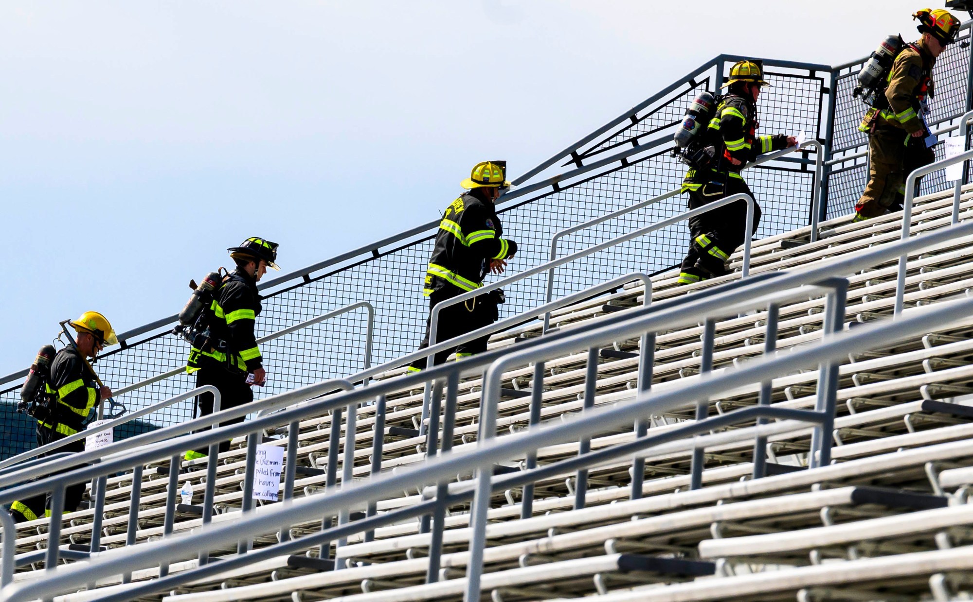 Local firefighters climb the stadium steps Friday, Sept. 11, 2026, at BASD Stadium in Bethlehem. Bethlehem Area high school students, staff, first responders, military personnel and community partners came together for a student-centered 9/11 remembrance event in which students from Freedom and Liberty High Schools climbed the stadium steps, walked the track and engaged in other activities to remember the lives lost 25 years ago. The goal was to climb 2,200 stairs or walk three miles, symbolizing 110 flights of stairs in one of the World Trade Center towers.(April Gamiz/The Morning Call)