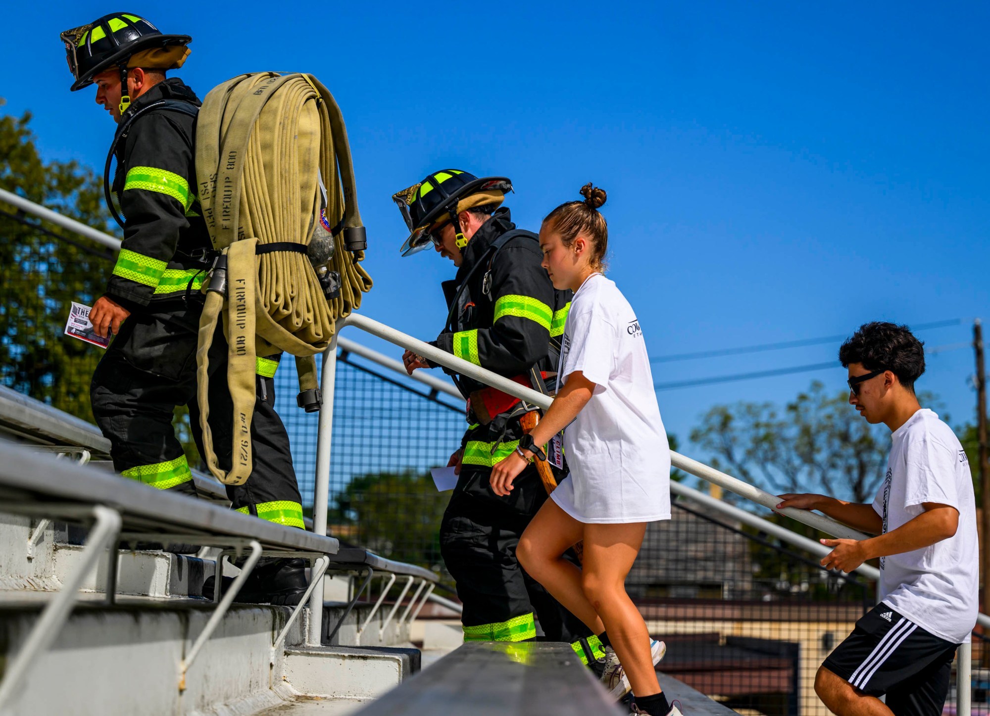 City of Bethlehem firefighters Kyle Jimenez and Kyle Pochek and Liberty students Hannah Broadhead and Anthony Zappa climb the stadium steps Friday, Sept. 11, 2026, during "The Climb" event at BASD Stadium in Bethlehem. Bethlehem Area high school students, staff, first responders, military personnel and community partners came together for a student-centered 9/11 remembrance event in which students from Freedom and Liberty High Schools climbed the stadium steps, walked the track and engaged in other activities to remember the lives lost 25 years ago. The goal was to climb 2,200 stairs or walk three miles, symbolizing 110 flights of stairs in one of the World Trade Center towers. (April Gamiz/The Morning Call)