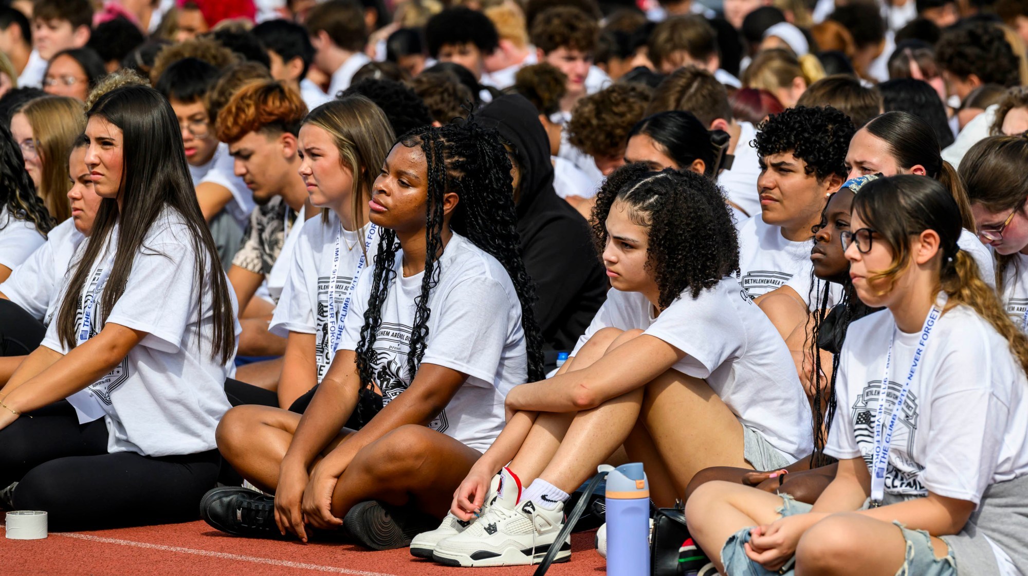 Over 2,300 students and others gather Friday, Sept. 11, 2026, for "The Climb" event at BASD Stadium in Bethlehem. Bethlehem Area high school students, staff, first responders, military personnel and community partners came together for a student-centered 9/11 remembrance event in which students from Freedom and Liberty High Schools climbed the stadium steps, walked the track and engaged in other activities to remember the lives lost 25 years ago. The goal was to climb 2,200 stairs or walk three miles, symbolizing 110 flights of stairs in one of the World Trade Center towers.(April Gamiz/The Morning Call)