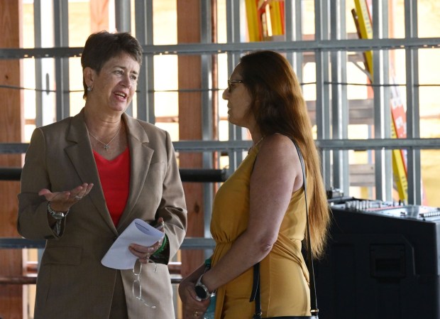 ArtsQuest president and CEO Kassie Hilgert, left, attends a beam-signing ceremony Friday, Sept. 18, 2026, at the new Jefferson Health Turn & Grind Shop at SteelStacks in Bethlehem. ArtsQuest leadership, elected officials, Lehigh Valley Health Network/Jefferson Health representatives, project partners and community leaders signed a steel beam that will become part of the revitalized building. (Monica Cabrera/The Morning Call)