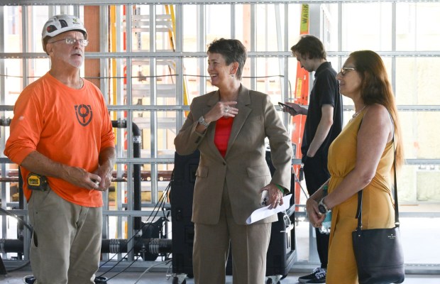ArtsQuest president and CEO Kassie Hilgert mingles with workers and attendees Friday, Sept. 18, 2026, during a beam-signing ceremony at the new Jefferson Health Turn & Grind Shop at SteelStacks in Bethlehem. ArtsQuest leadership, elected officials, Lehigh Valley Health Network/Jefferson Health representatives, project partners and community leaders signed a steel beam that will become part of the revitalized building. (Monica Cabrera/The Morning Call)