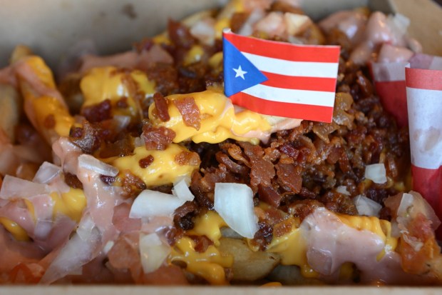 Loaded Fries is served Thursday, Sept. 24, 2026, at Chinchorro restaurant in Easton. Like their sister food truck La Frikitona, Chinchorro serves food items such as tostones, mofongo, sancocho, canoas and pastelillos. (Monica Cabrera/The Morning Call)
