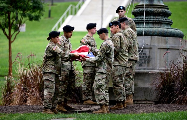 The flag is unfurled as Lehigh University and the Steel Battalion Army ROTC Program hold their annual 9/11 memorial event Friday, Sept. 11, 2026, in Bethlehem, to mark the 25th anniversary of the terror attacks. The ceremony included a flag raising, moment of silence and the planting of the 2,977 American flags to honor the lives lost. (Monica Cabrera/The Morning Call)