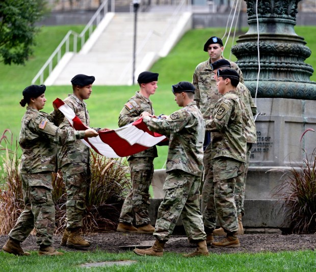 The flag is unfurled as Lehigh University and the Steel Battalion Army ROTC Program hold their annual 9/11 memorial event Friday, Sept. 11, 2026, in Bethlehem, to mark the 25th anniversary of the terror attacks. The ceremony included a flag raising, moment of silence and the planting of the 2,977 American flags to honor the lives lost. (Monica Cabrera/The Morning Call)