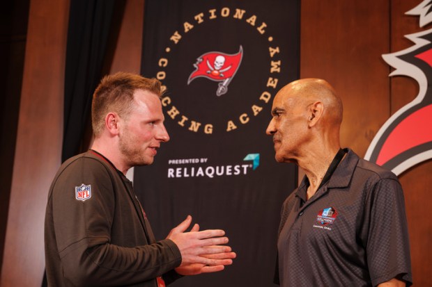 East Stroudsburg South football coach Matt Walters talks with former NFL coach and current NBC analyst Tony Dungy in 2025 during the Tampa Bay Buccaneers National Coaching Academy in Tampa. (Contributed photo/Tampa Bay Buccaneers)