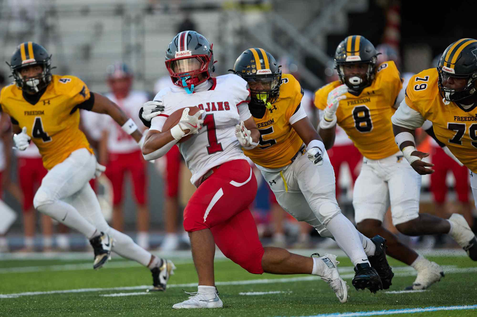 Parkland's T.J. Lawrence is tackled by Freedom's Jahaire Hughes on Friday, Sept. 4, 2026, at Bethlehem School District Stadium. (David Garrett/Special to The Morning Call)