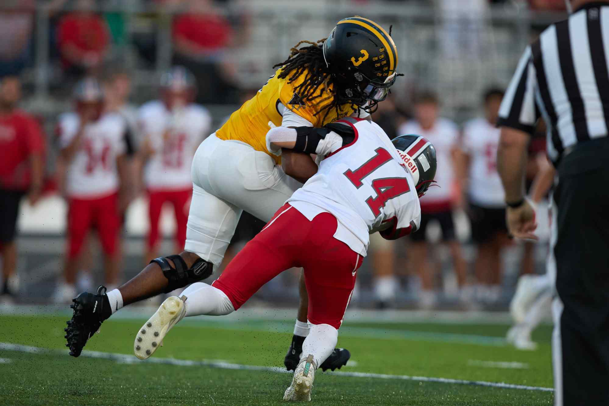 Freedom's Lashawn Johnson is tackled by Parkland's Justin Barnes on Friday, Sept. 4, 2026, at Bethlehem School District Stadium. (David Garrett/Special to The Morning Call)