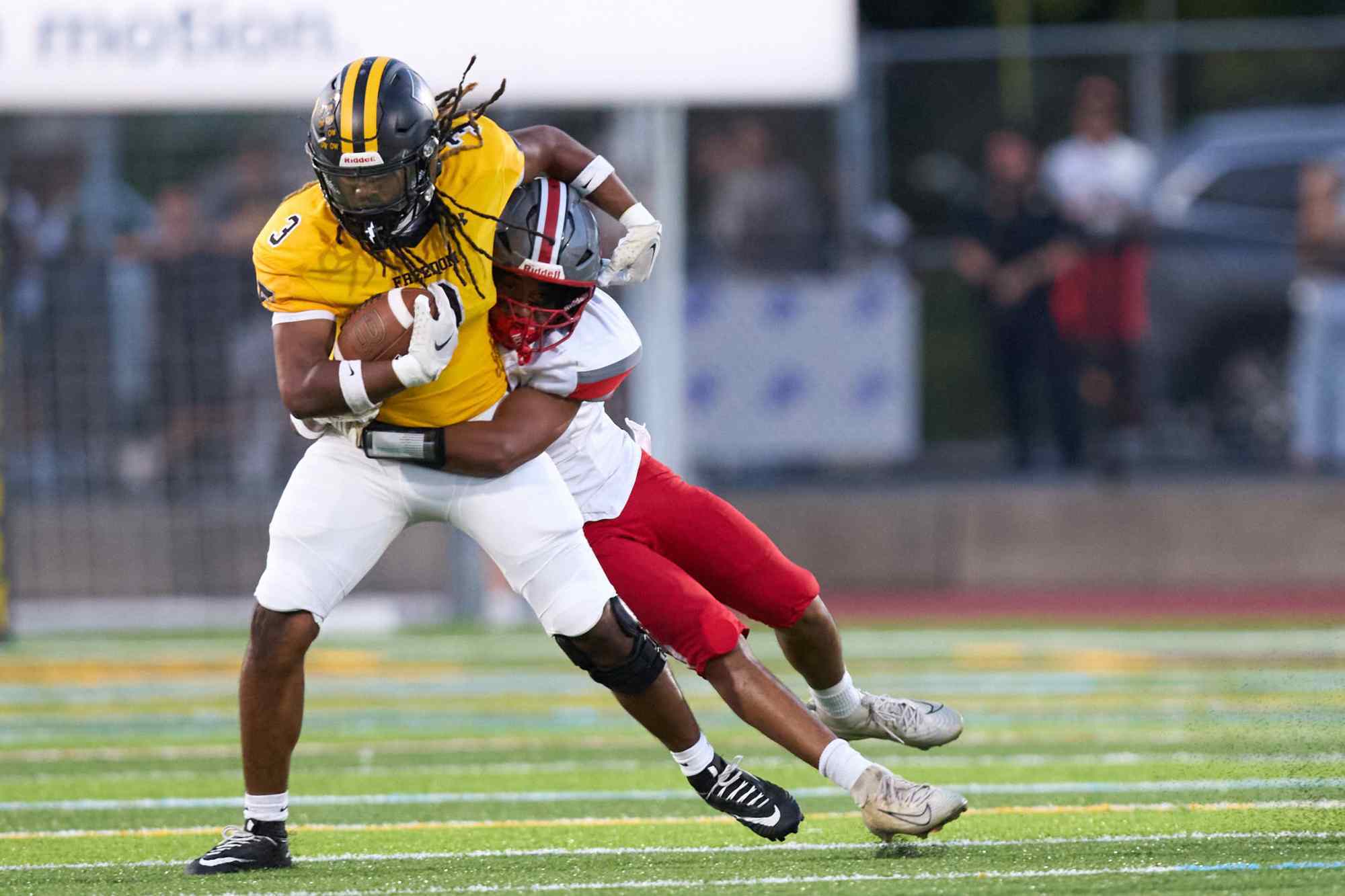 Freedom's Lashawn Johnson is tackled by Parkland's T.J. Lawrence on Friday, Sept. 4, 2026, at Bethlehem School District Stadium. (David Garrett/Special to The Morning Call)