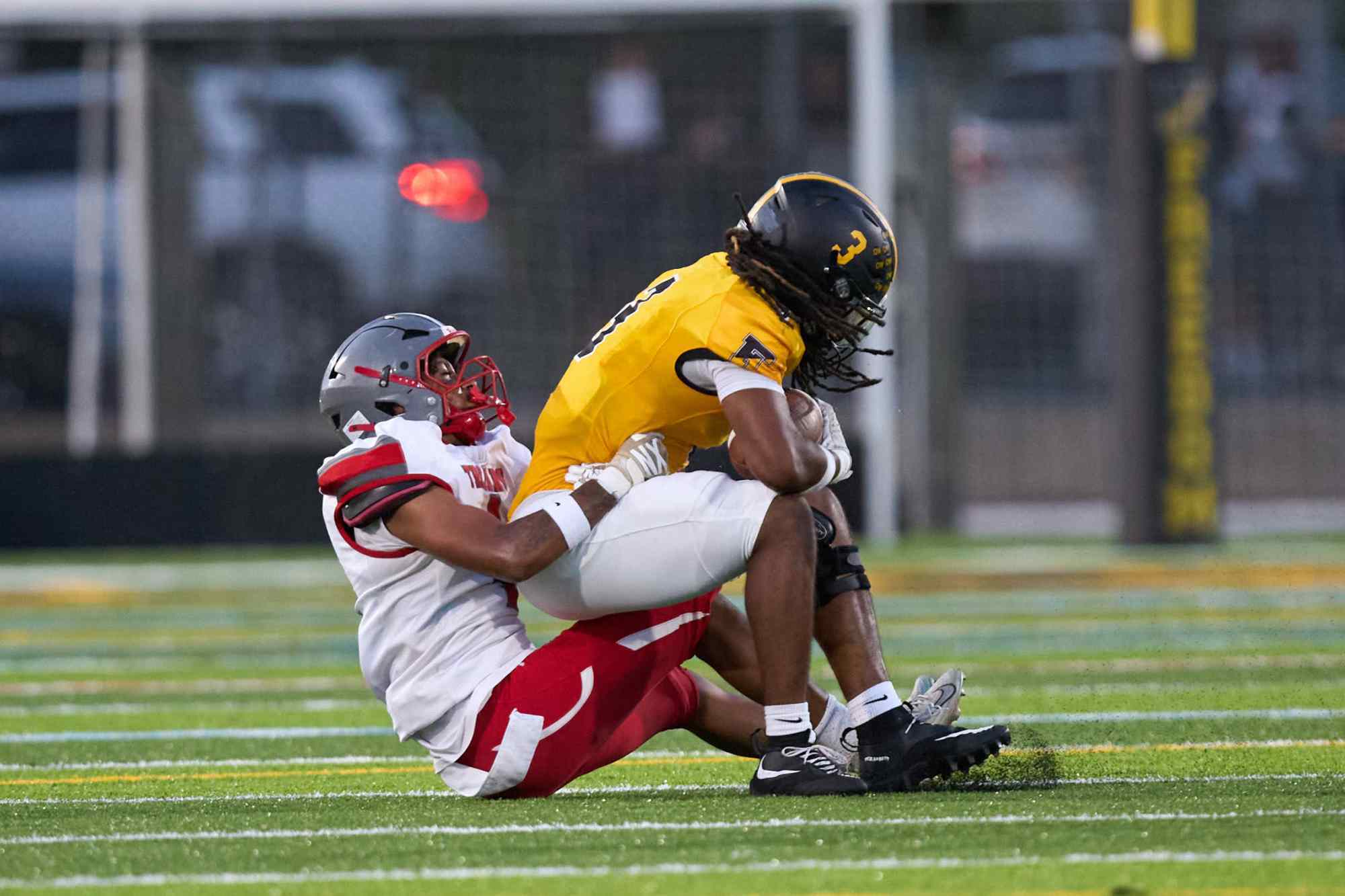 Freedom's Lashawn Johnson is tackled by Parkland's T.J. Lawrence on Friday, Sept. 4, 2026, at Bethlehem School District Stadium. (David Garrett/Special to The Morning Call)