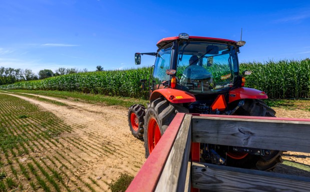 Chris Colitas, co-owner of Valley Fruits & Veggies, drives a tractor Friday, Sept. 25, 2026, at the farm on Locust Road in East Allen Township. Valley Fruits & Veggies offers snacks like apple cider slushies and handmade apple cider donuts, as well as a corn maze, tractor rides, goats and a fun play area. (April Gamiz/The Morning Call)