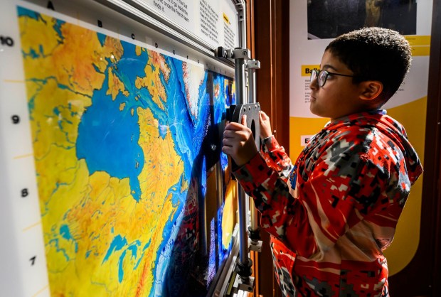Allentown School District fifth grader Zabdiel looks at maps in the "Finding Titanic: The Secret Mission" exhibit Tuesday, Sept. 29, 2026, at Da Vinci Science Center at PPL Pavilion. The  exhibit, which explores the story behind how the wreck of the RMS Titanic was found and the secret Cold War mission that made the historic discovery possible, runs through Jan. 19. (April Gamiz/The Morning Call)
