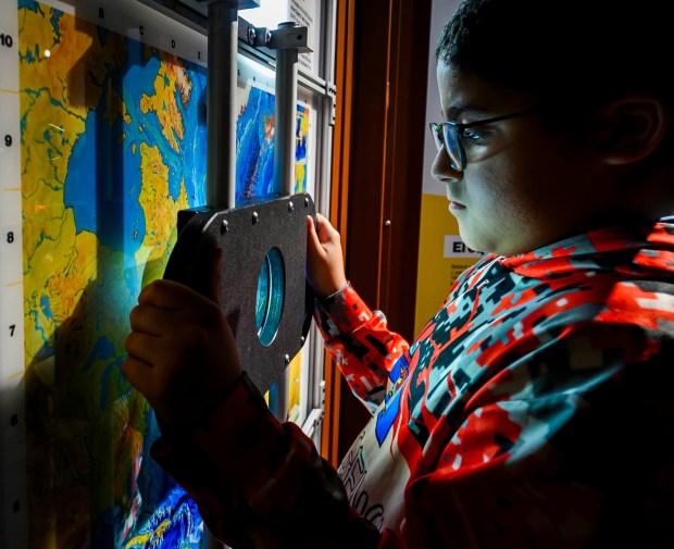 Allentown School District fifth grader Zabdiel looks at maps in the "Finding Titanic: The Secret Mission" exhibit Tuesday, Sept. 29, 2026, at Da Vinci Science Center at PPL Pavilion. The  exhibit, which explores the story behind how the wreck of the RMS Titanic was found and the secret Cold War mission that made the historic discovery possible, runs through Jan. 19. (April Gamiz/The Morning Call)