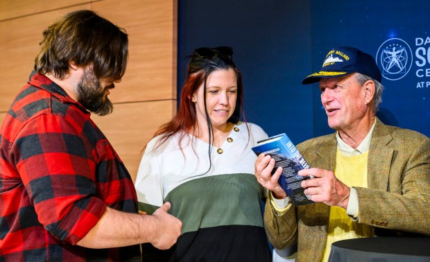 Robert Ballard, best known for his discovery of the RMS Titanic, meets Danielle and Ben Yenser on Tuesday, Sept. 29, 2026, after speaking to Allentown School District fifth graders and community members at Da Vinci Science Center at PPL Pavilion. The "Finding Titanic: The Secret Mission" exhibit, which explores the story behind how the wreck was found and the secret Cold War mission that made the historic discovery possible, runs through Jan. 19. (April Gamiz/The Morning Call)